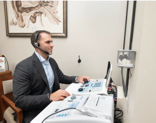 Jared Talarico performing a hearing test