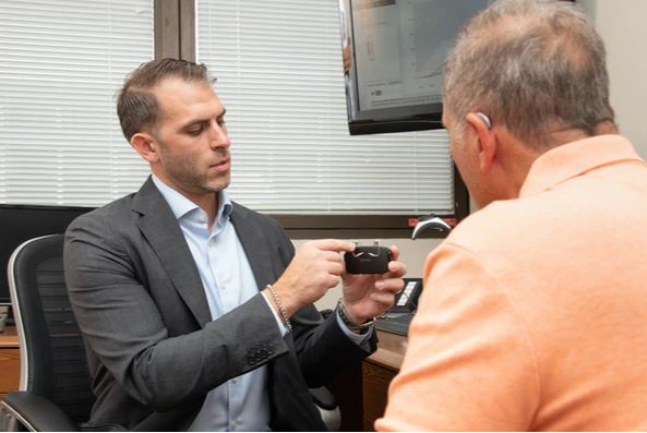 Jared Talarico, our Hearing Instrument Specialist with a patient