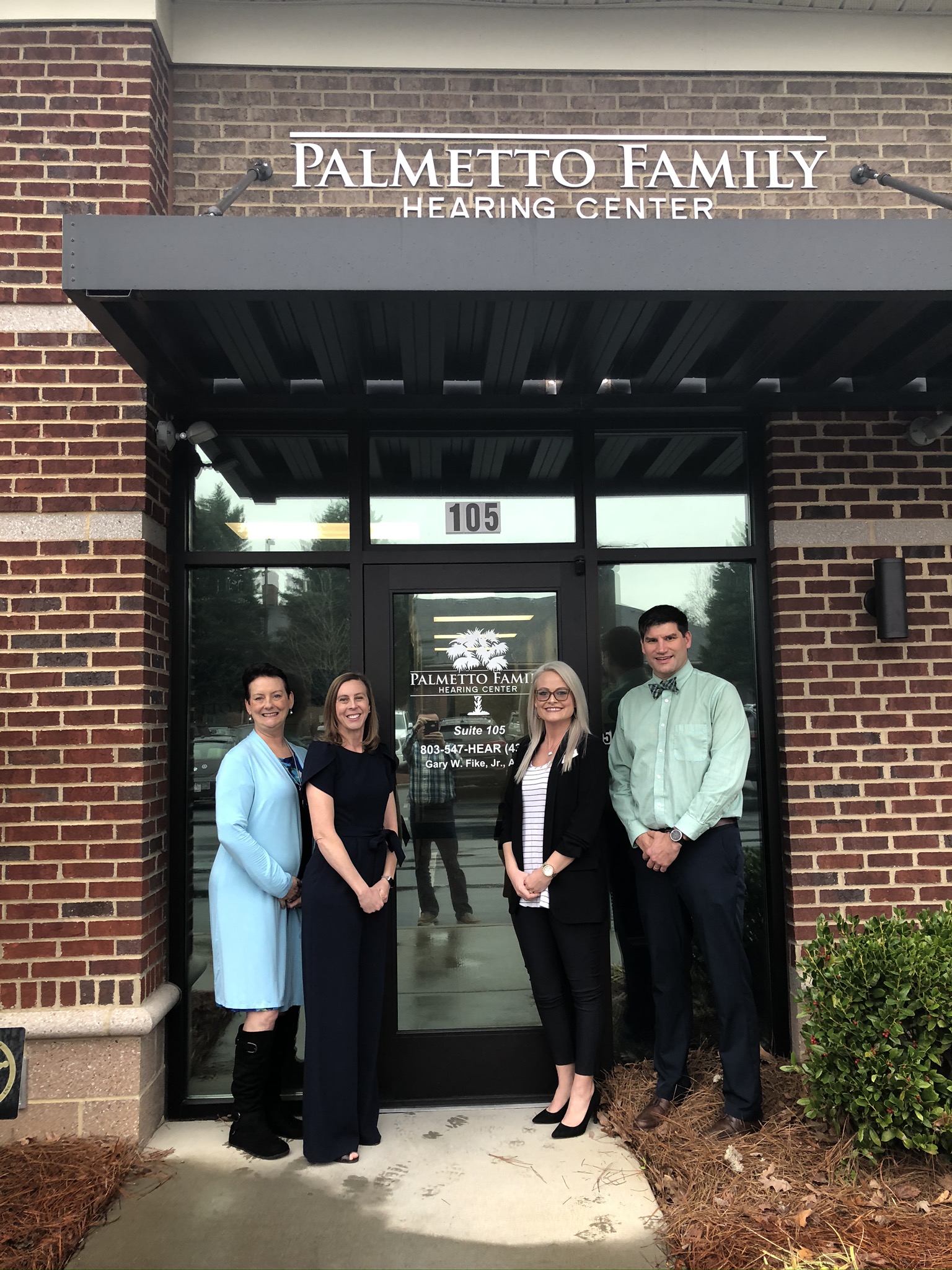 Staff in front of clinic