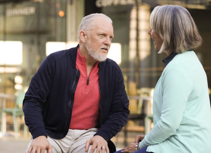 A woman talks while wearing hearing aids. 