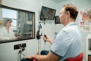 A man receives a hearing test.